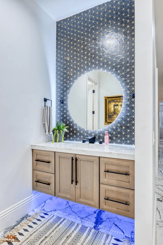 Moody Bathroom Vanity with Star Pattern Accent Wall & Backlit Mirror
