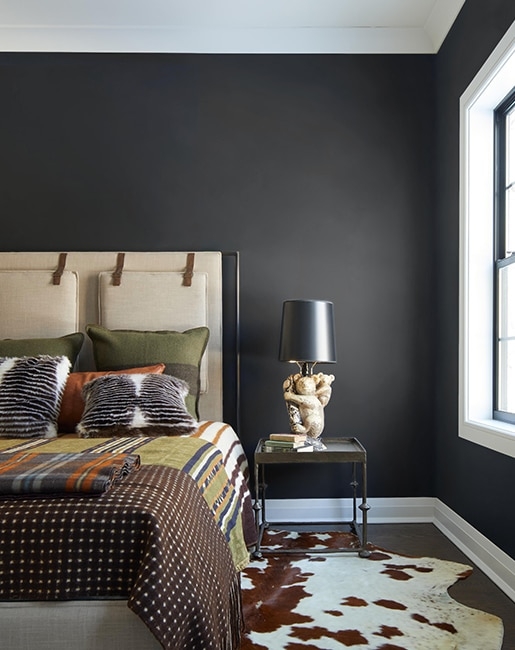 Moody Black Bedroom Walls with Strapped Headboard