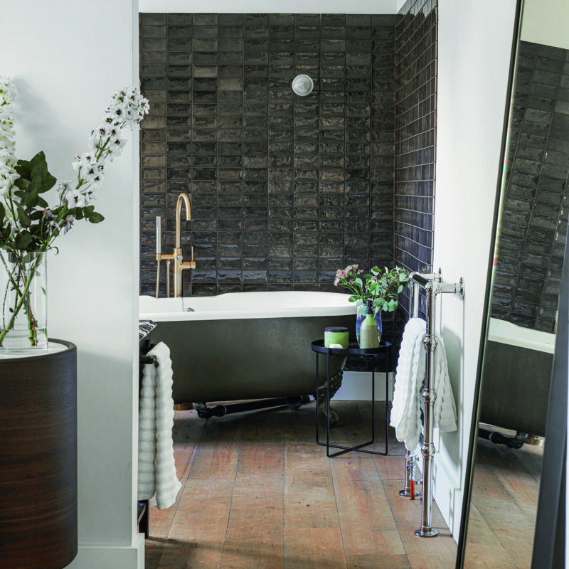 Moody Contemporary Bathroom with Dark Textured Tiles & Clawfoot Tub