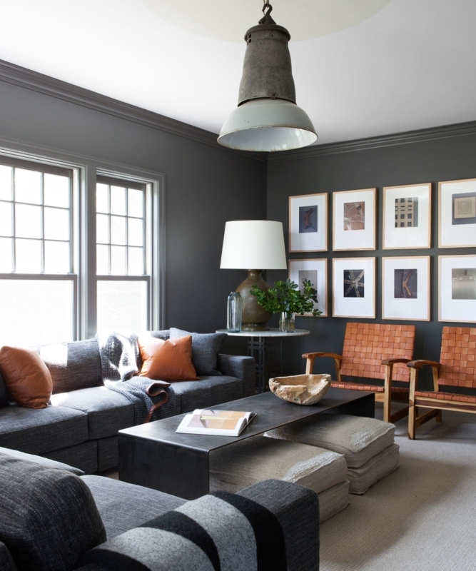 Moody Living Room with Charcoal Walls and Woven Leather Accent Chairs