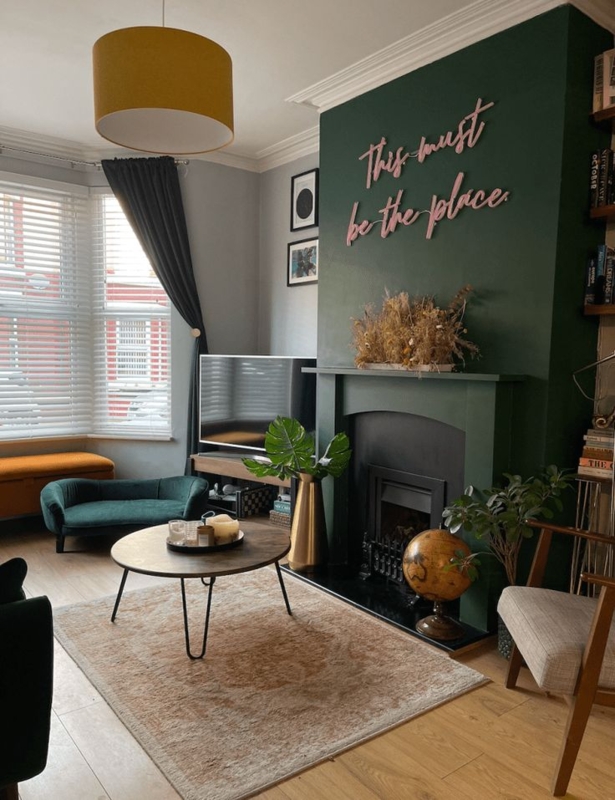Moody Living Room with Forest Green Wall and Pink Script Art