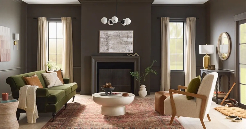 Moody Living Room with Green Velvet Sofa and Dark Brown Walls