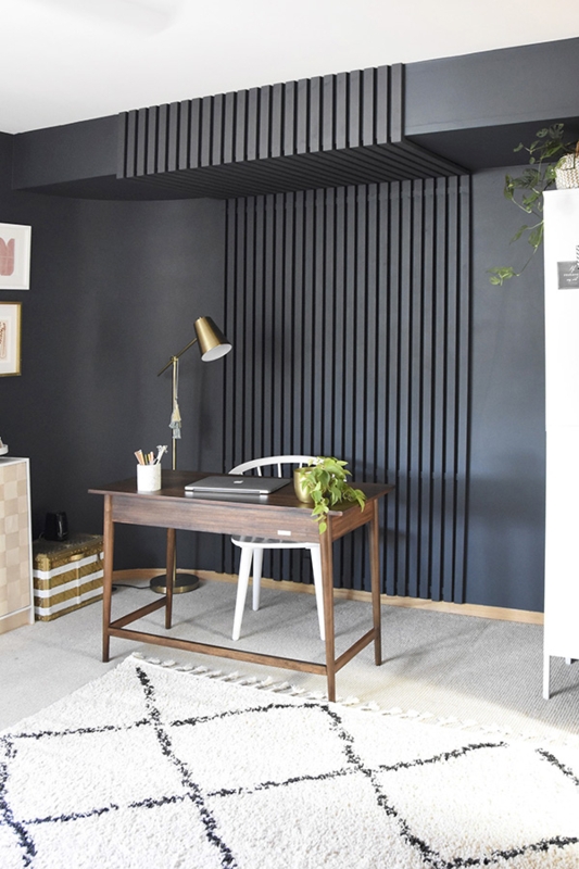 Moody Writing Desk Area with White Spindle Chair and Black Slat Wall