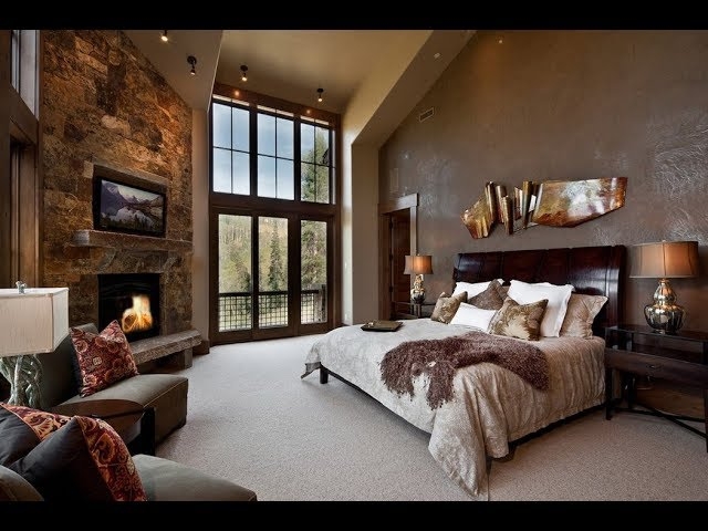 Mountain Lodge Bedroom with Stone Fireplace Wall and Metallic Sculpture