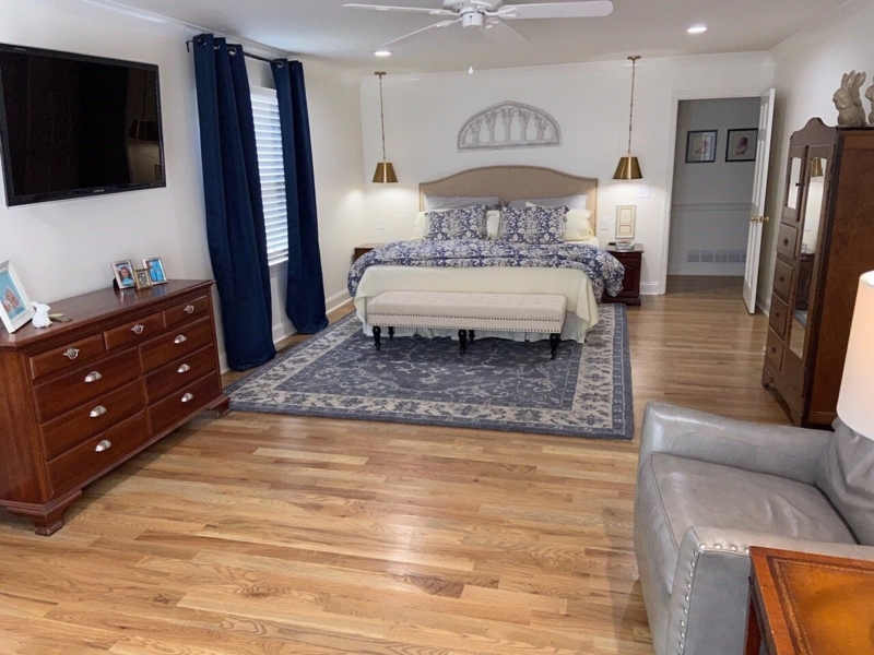 Narrow Bedroom Layout Ideas with Navy Accents and Bedside Pendant Lights