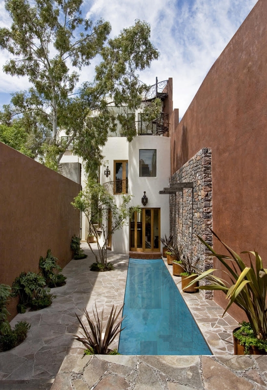 Narrow Courtyard Lap Pool with High Terracotta Walls