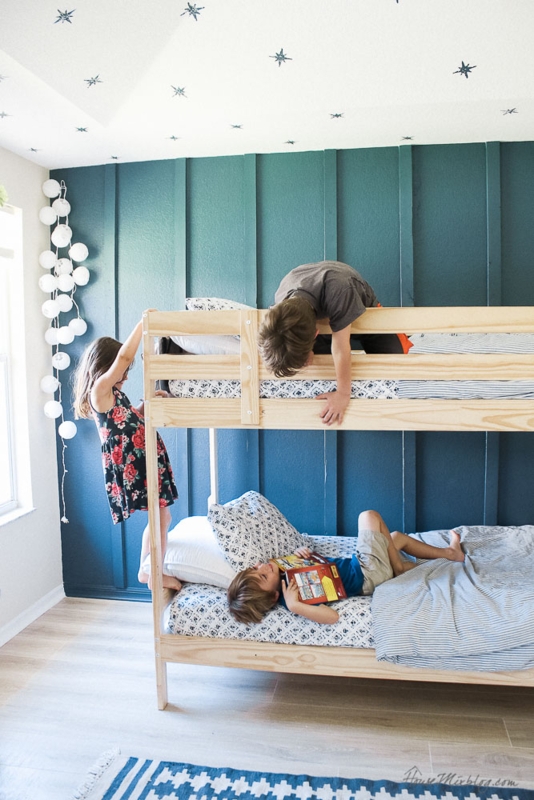 Natural Wood Bunk Bed with Teal Board and Batten Wall