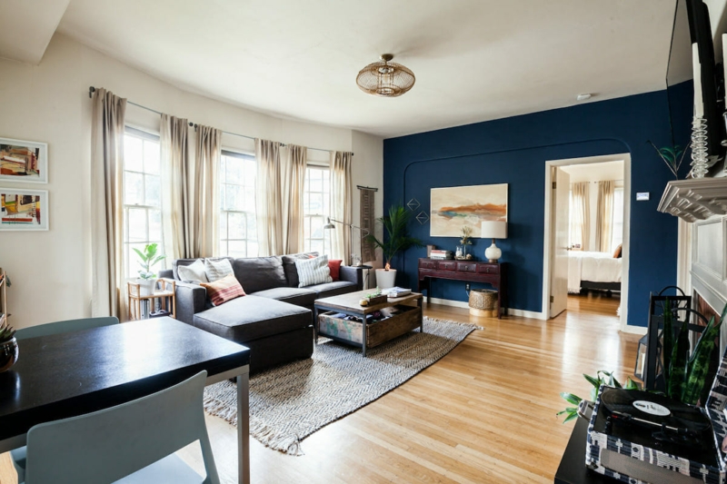 Navy Blue Accent Wall Living Room with Charcoal Sectional Sofa
