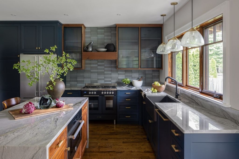 Navy Blue Kitchen Cabinets with Marble Island and Ribbed Glass.
