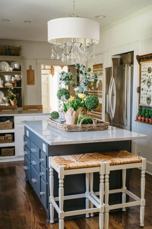 Navy Blue Kitchen Island with Woven Stools and Crystal Light