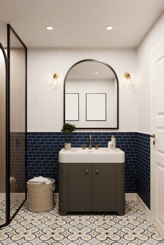 Navy Blue Subway Tile Bathroom with Striped Wallpaper and Arched Mirror