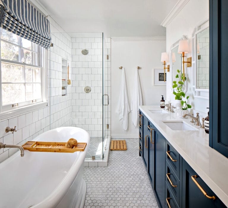 Navy Blue Vanity Bathroom with Gold Hardware and Subway Tile