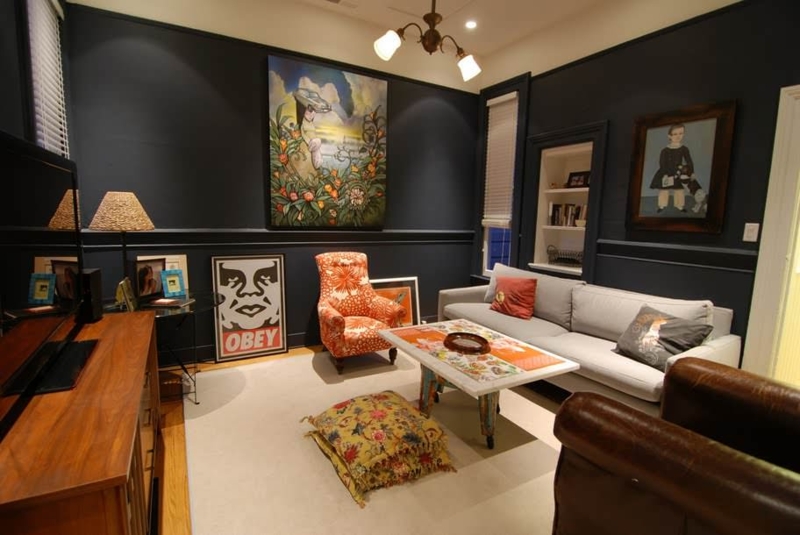 Navy Blue Walls in Eclectic Living Room with Orange Floral Chair