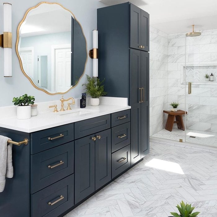 Navy Cabinetry Vanity with Scalloped Gold Mirror
