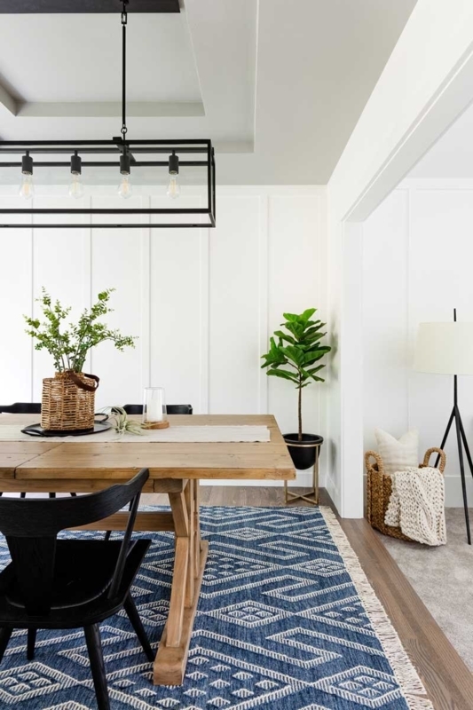 Navy Geometric Area Rug Anchoring a Transitional Dining Room