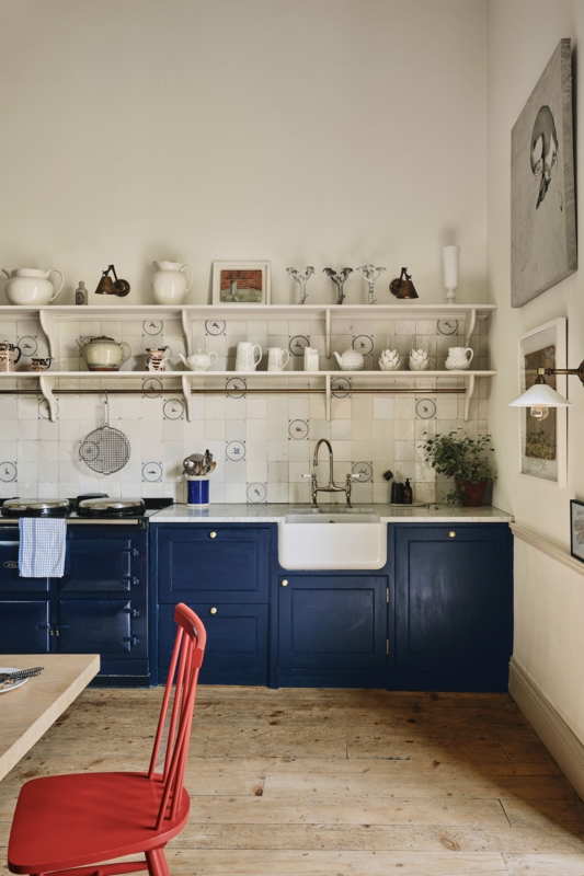 Navy Kitchen Cabinets paired with a Unique Patterned Tile Backsplash