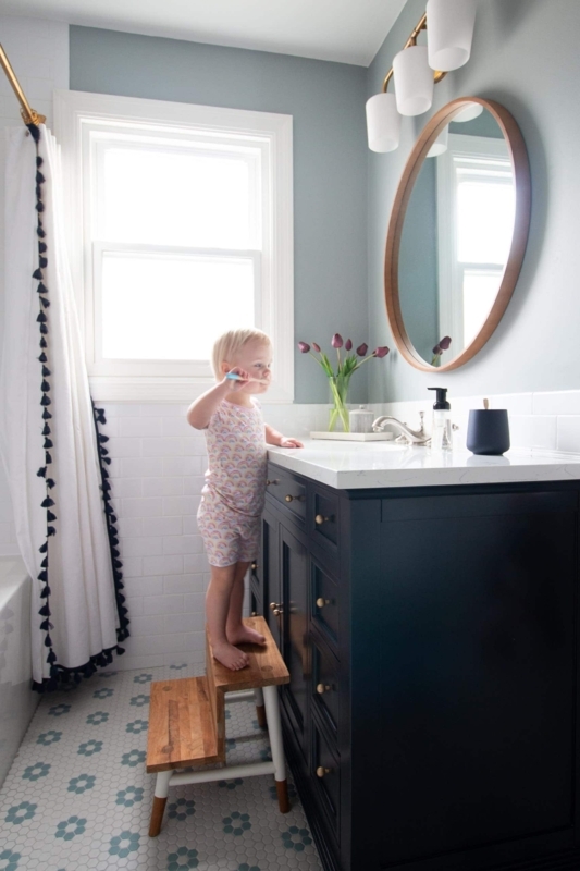 Navy Vanity Kids Bathroom with Floral Penny Tile Floor Patterns
