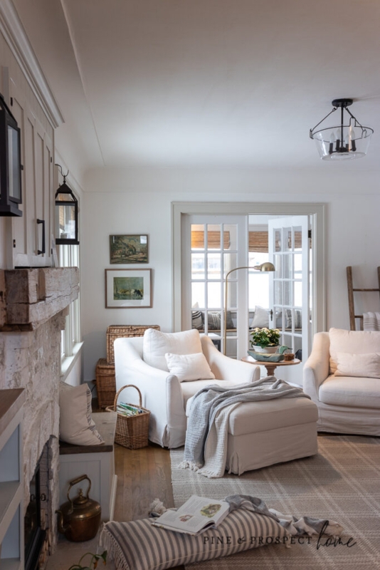 Neutral Cottage Living Room Decor with Stone Fireplace Surround