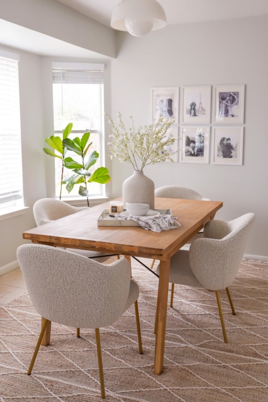 Neutral Dining Room with Boucle Chairs and Diamond Jute Rug Decor