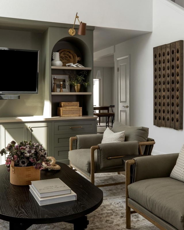 Olive Green Wood Frame Lounge Chairs in a Moody Living Room