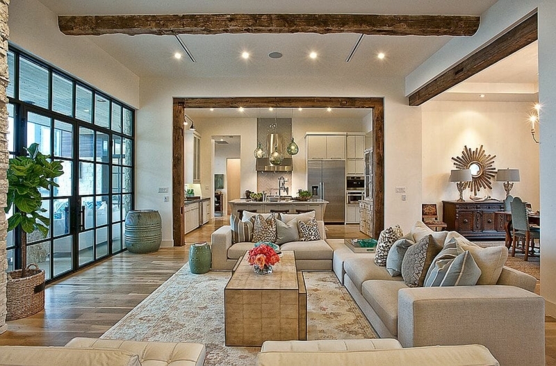 Open Concept Living Room with Rustic Wood Beams and Black Grid Windows