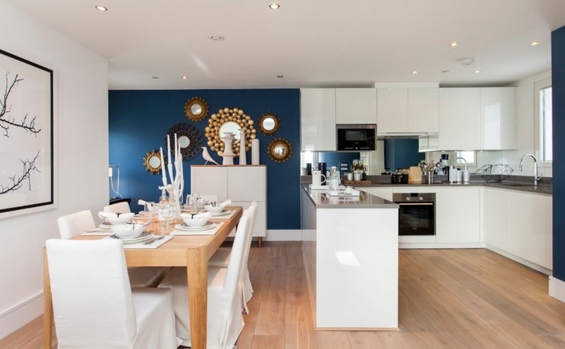 Open Plan Dining Room with Gold Sunburst Mirrors & Gloss Kitchen