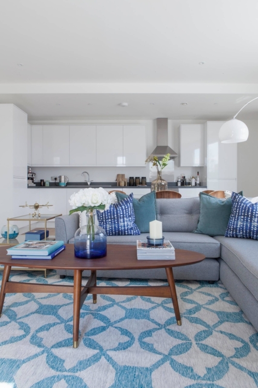 Open Plan Living with Blue Quatrefoil Rug and Kitchen Combo