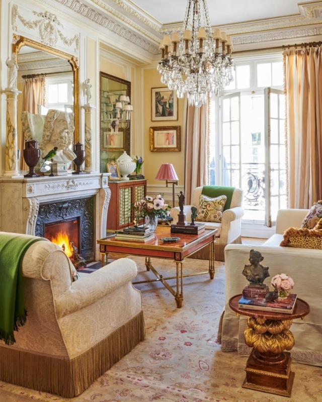 Opulent Living Room with Fireplace and Large Crystal Chandelier
