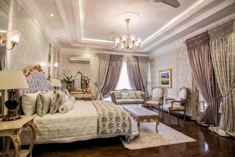 Opulent Traditional Bedroom Layout with Gilded Trim and Layered Drapery