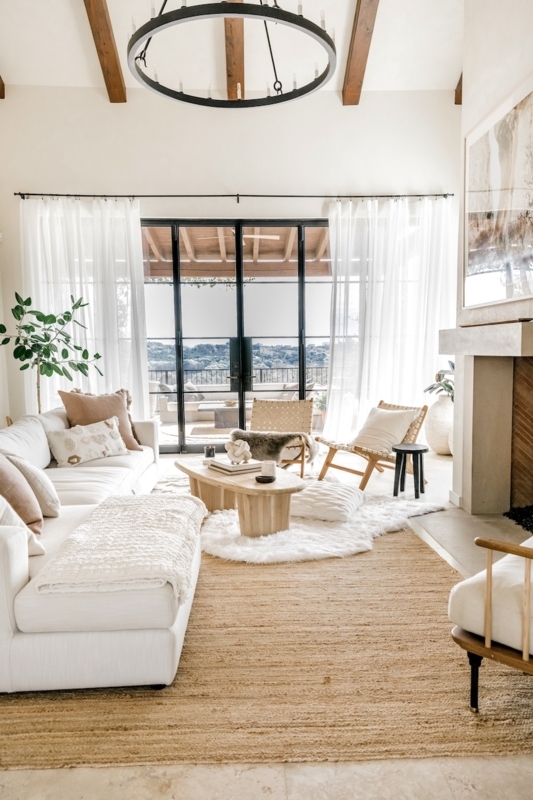 Organic Modern Space with Layered Rugs and Black Framed French Doors