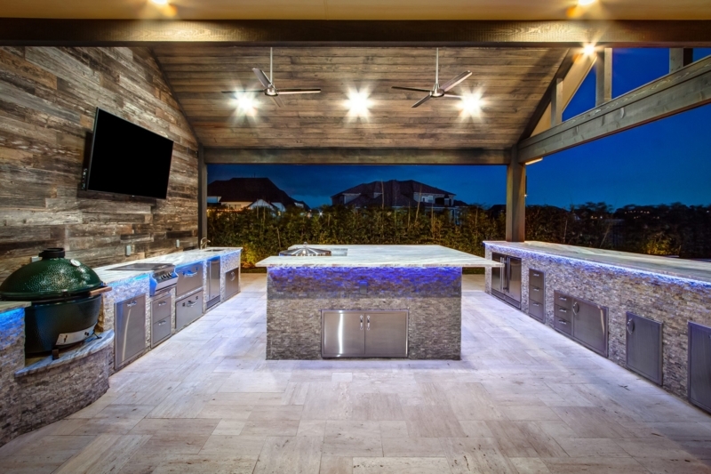 Outdoor Kitchen with Blue LED Lighting and Stone Clad Island