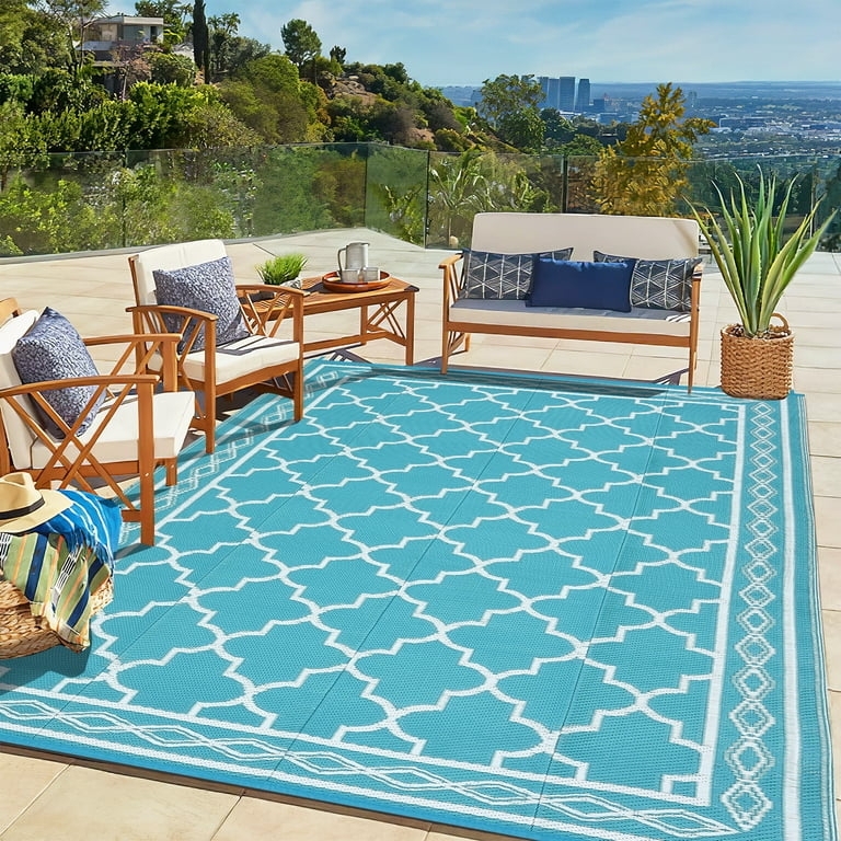 Outdoor Rug: Navy Plastic Straw Trellis Mat on Wood Deck