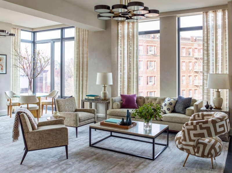 Oversized Neutral Area Rug in a Modern Luxury Apartment Living Room.