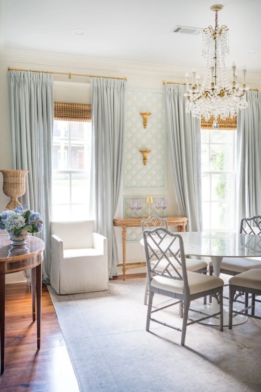 Pale Blue Pleated Drapes against Decorative Lattice Wall Paneling