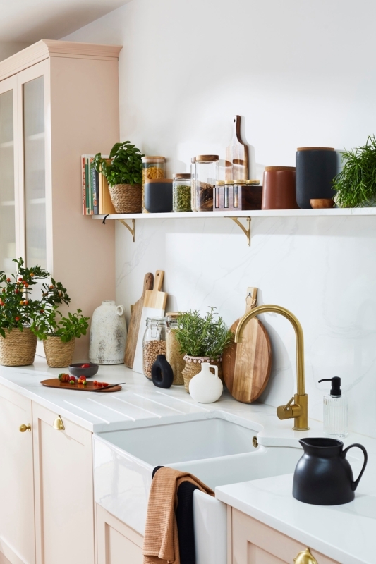 Pale Pink Kitchen Cabinets with Gold Hardware and Open Shelving