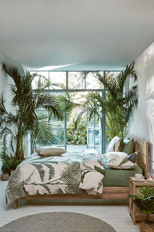 Palm Leaf Bedding and Oversized Indoor Palms in a Contemporary Bedroom