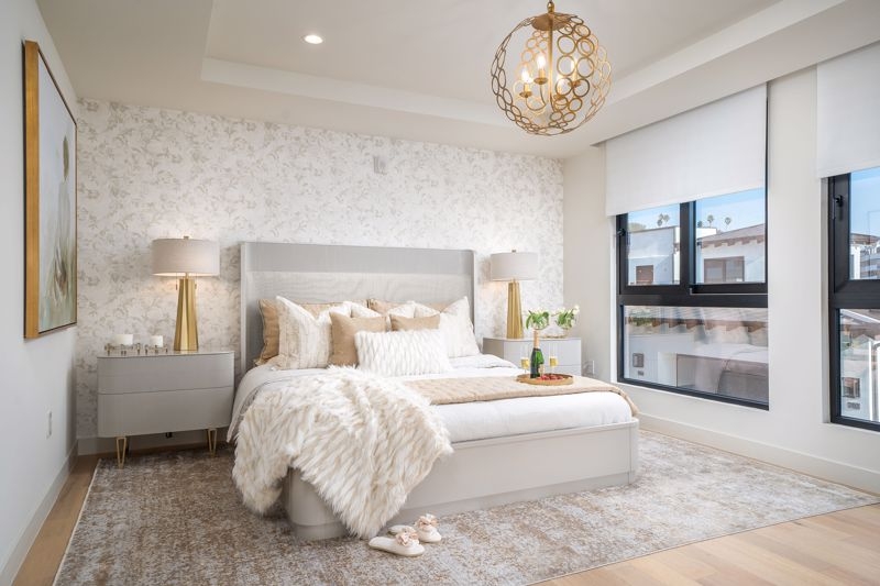 Panel Bed with Gold Accents & Faux Fur Throw in Neutral Glam Bedroom