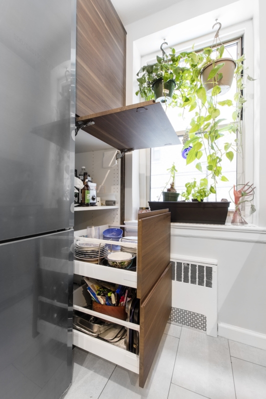 Pantry Cabinet with Lift-Up Door Mechanism and Concealed Drawers