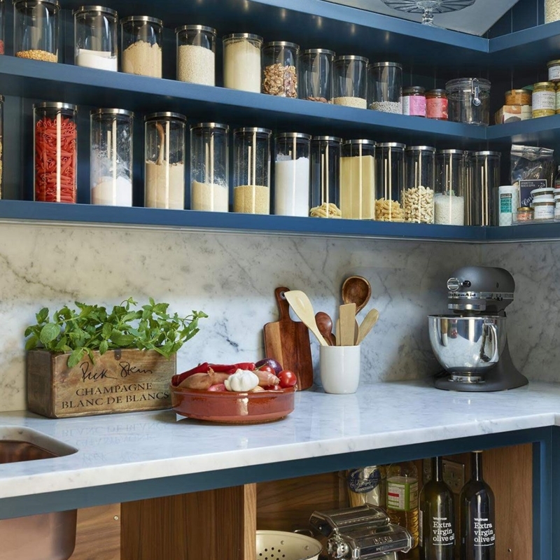 Pantry Shelving: Navy Blue with Marble Backsplash & Glass Canisters