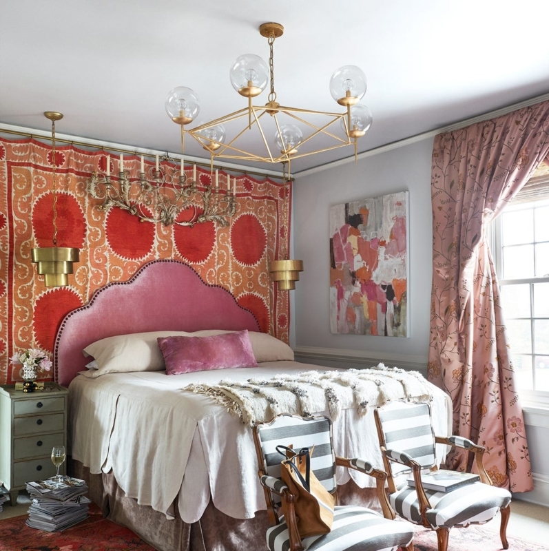 Patterned Suzani Wall Hanging Behind Pink Velvet Arched Headboard