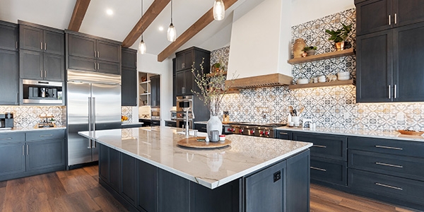 Patterned Tile Backsplash in Kitchen with Vaulted Wood Ceiling Beams