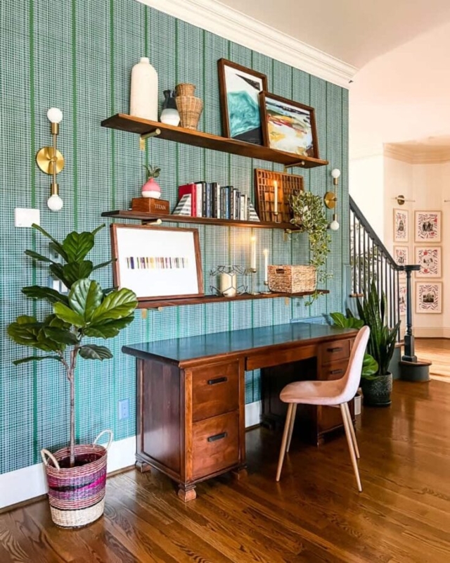Pedestal Writing Desk with Green Plaid Accent Wall and Tiered Shelves