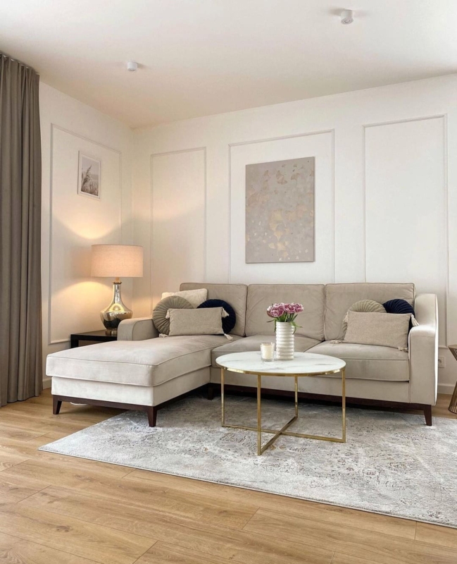 Picture Frame Wall Molding and Marble-Topped Coffee Table Decor