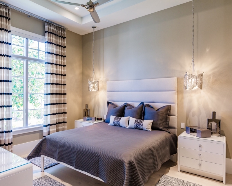 Platform Bed featuring Channeled Headboard and Bedside Pendants