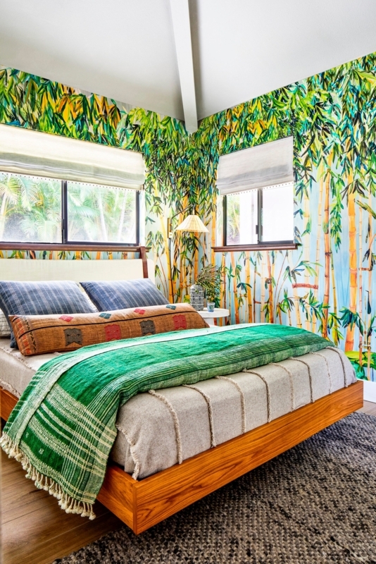 Platform Bed in Tropical Bedroom with Bamboo Wallpaper & Green Throw