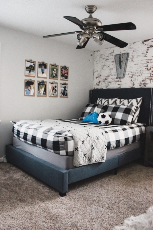 Platform Bed with Buffalo Plaid Bedding and Whitewashed Brick Wall