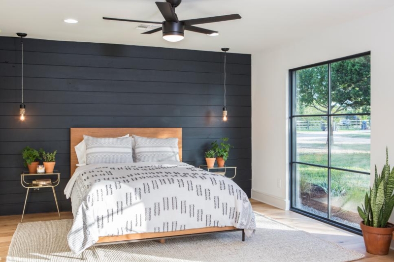 Platform Bed with Exposed Bulb Pendants and Black Grid Window