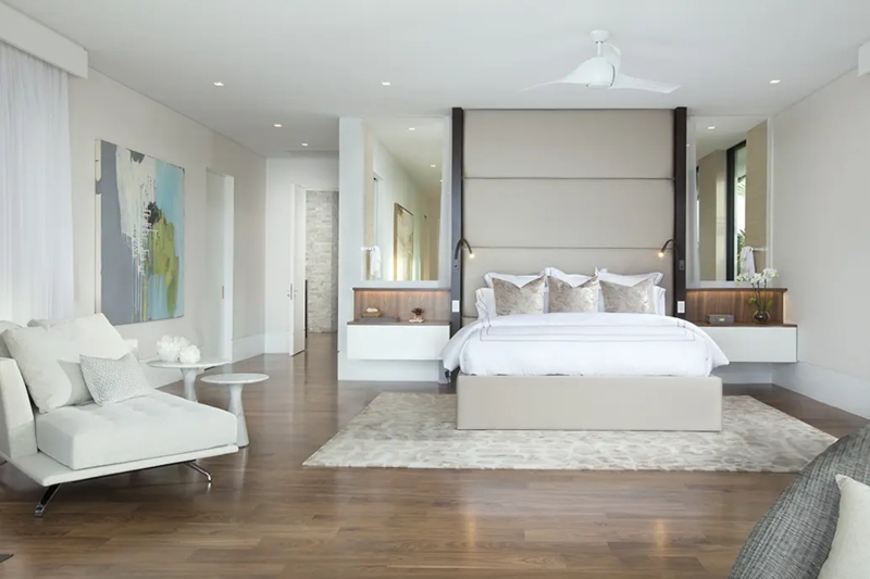 Platform Bed with Floating Nightstands and Mirrored Wall Panels