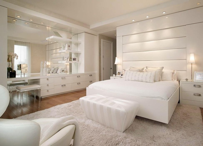 Platform Bed with Horizontal Padded Wall and Integrated Mirrored Vanity