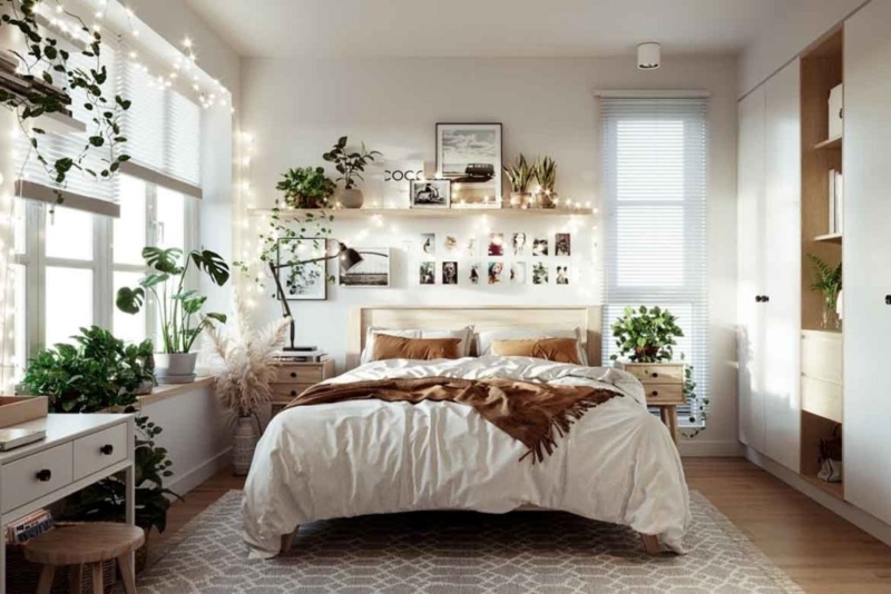 Platform Bed with Rust Bedding and Fairy Lights in Boho Bedroom